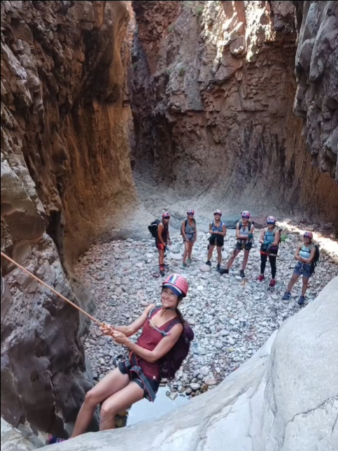 woman rappelling in hog canyon